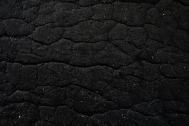 asfalto em textura de rachaduras / fundo abstrato rachaduras na estrada asfaltada