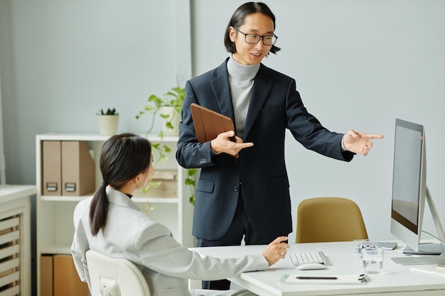 Asian Business Manager Leading Meeting