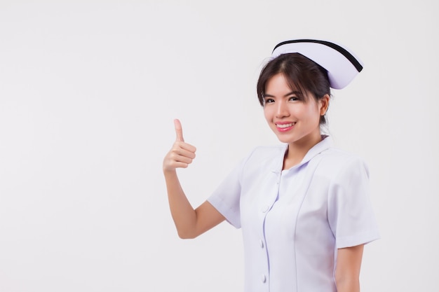 Asiatische Krankenschwester mit Daumen nach oben