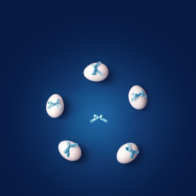 Assista com flechas de ovos brancos com laços azuis. Conceito sobre o tema da Páscoa