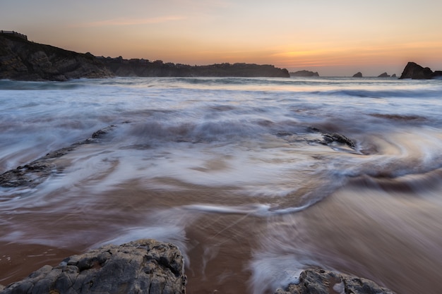 Atardecer en la playa de Portio. Liencres Cantabria. España.