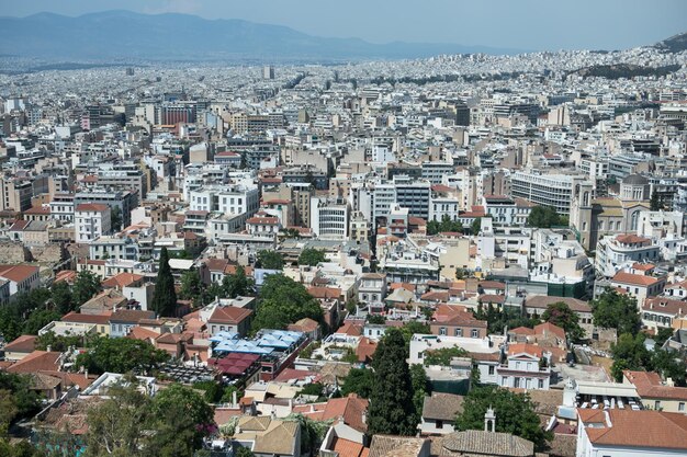 Atenas Grecia Acrópolis y el templo del Partenón hito Restos antiguos vista panorámica desde la colina de Lycabettus Paisaje urbano Fondo azul del mar y el cielo