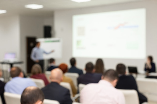 Audiência na sala de conferências. imagem borrada foto borrada.