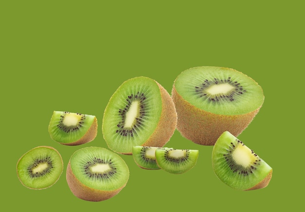 Auf einem grünen Hintergrund sind geschnittene und ganze Kiwis angeordnet. Das frische und saftige Aussehen der Kiwis ist optisch ansprechend.