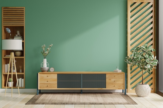 Auf einem grünen Wandhintergrund ein modernes Wohnzimmerdekor mit einem Fernsehschrank. 3D-Rendering