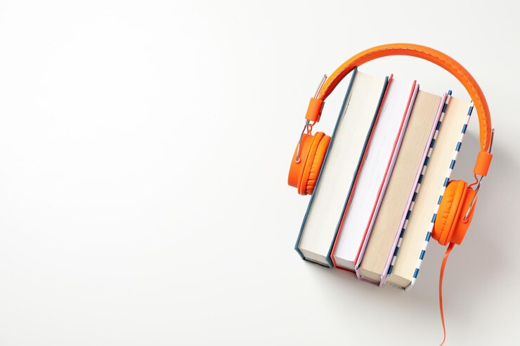 Auriculares en libros sobre fondo blanco espacio para texto