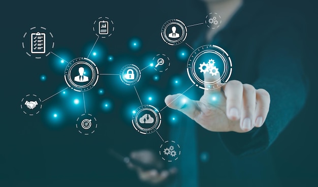 Automatización de procesos robóticos de flujos de trabajo empresariales con un hombre de negocios tocando un botón con engranajes e iconos Sistema de gestión de documentos concepto dms un sistema integral en forma digital electrónico