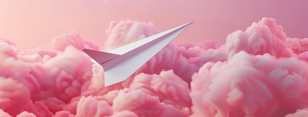 Un avión de papel volando a través de un paisaje de nubes rosadas de ensueño