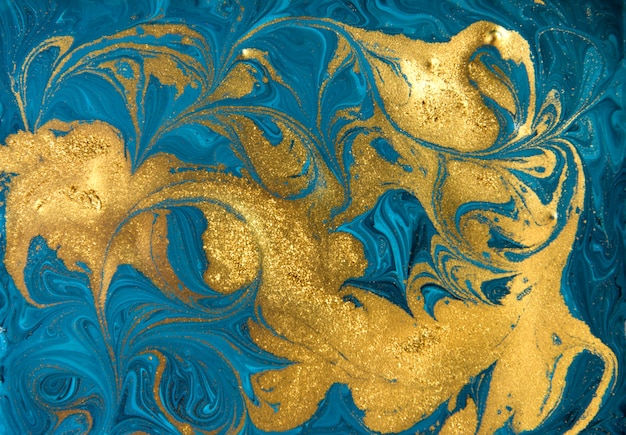 Azul e ouro padrão de marmorização. Textura líquida de mármore dourada.