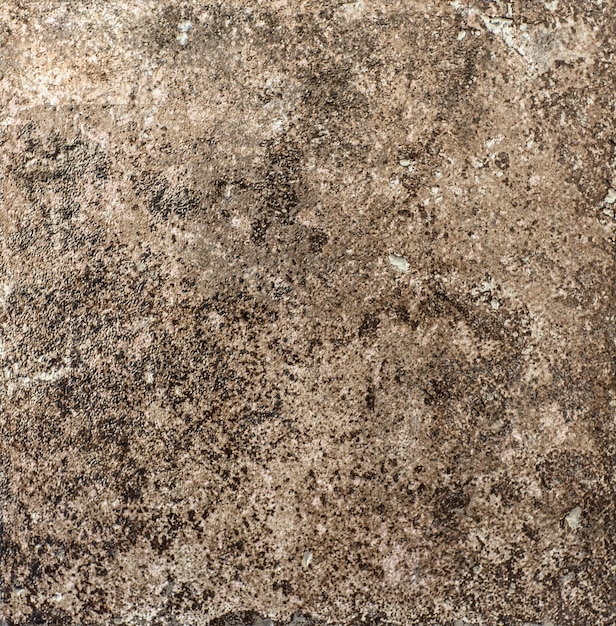 Foto azulejo de cerâmica marrom com padrão de superfície de pedra abstrata áspera