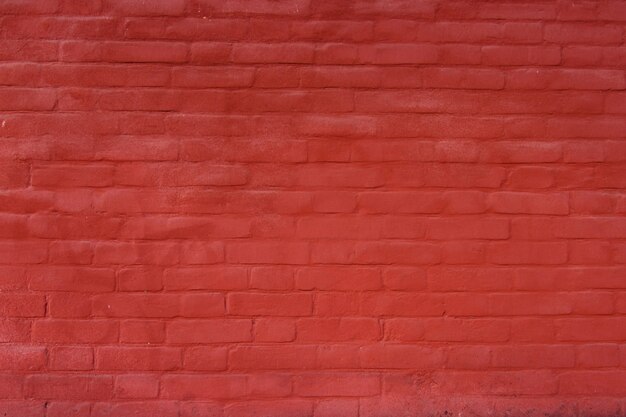 Backsteinmauer rot gemalt für Hintergrund oder Beschaffenheit