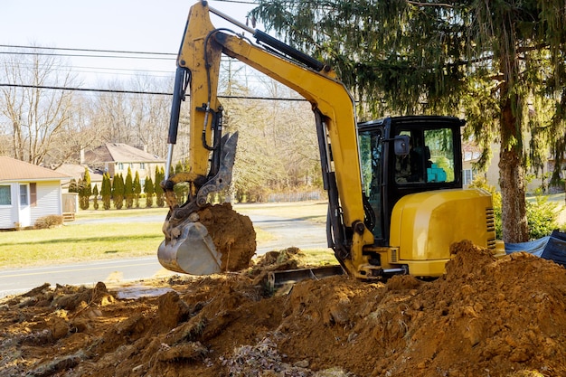 Foto baggerlader bei erdbewegungsarbeiten rund um die baustelle