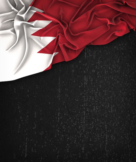 Bahrain-Flagge Vintag auf einem Grunge-Schwarz-Tafel mit Platz für Text