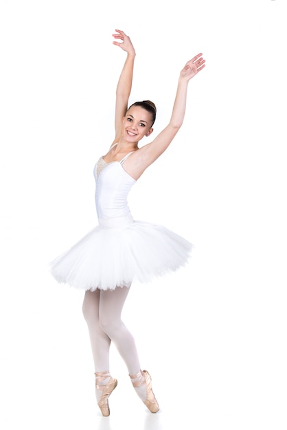 Bailarín de ballet hermoso joven en el baile en el sitio blanco.