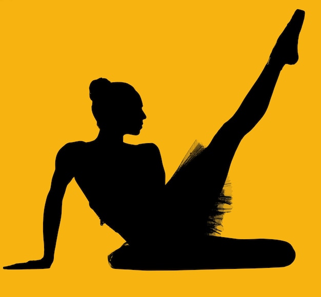 Foto bailarina de ballet de silueta bailando contra un fondo amarillo