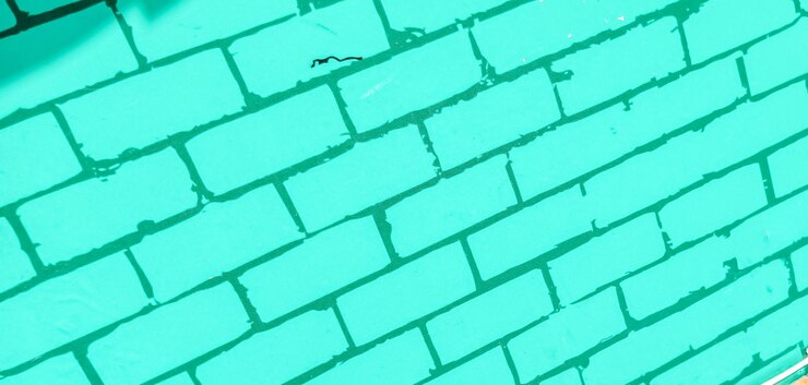 Foto una baldosa azul con un fondo verde con un agujero en él