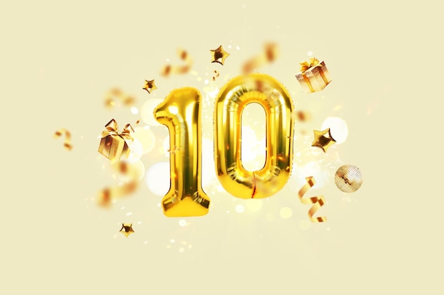 Balões festivos de ouro 10 com confete dourado apresenta bola de espelhos e estrelas voam em um fundo bege com bokeh luzes e faíscas Festa de aniversário de luxo dez cartão uma ideia criativa