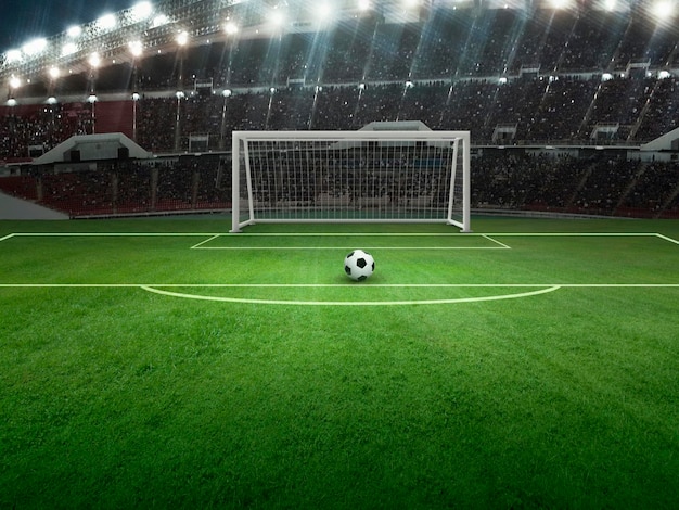 Balón en el campo verde en el estadio de fútbol listo para la pena de juego