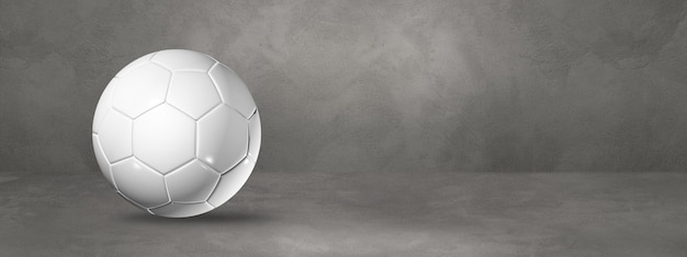 Balón de fútbol blanco aislado en un hormigón