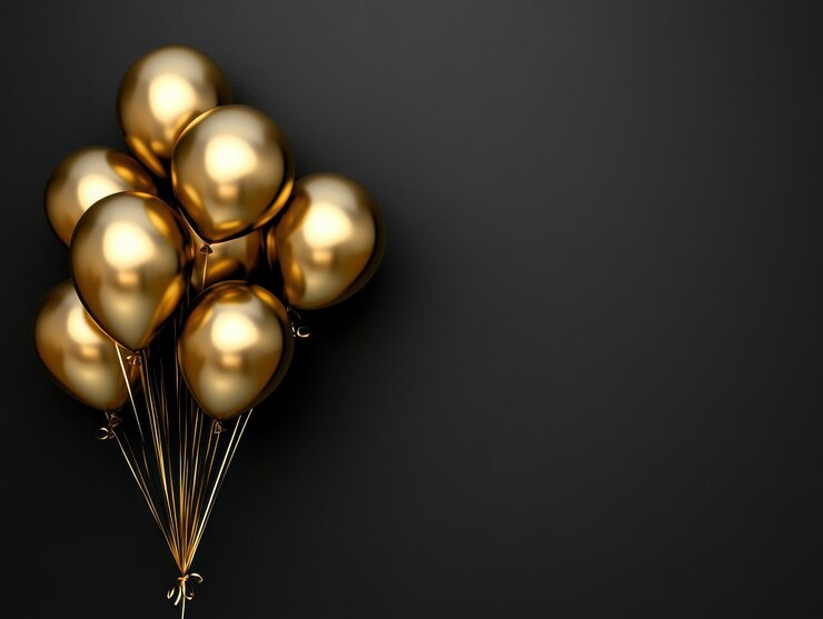 Balones dorados contra un fondo negro