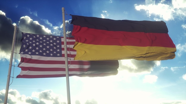 Foto bandeira da alemanha e dos estados unidos no mastro da bandeira alemanha e estados unidos acenando bandeira no vento ilustração 3d do conceito diplomático da alemanha e dos estados unidos