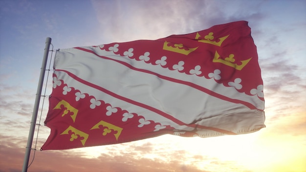 Bandeira da alsácia, frança, balançando ao vento, o céu e o sol de fundo. renderização 3d.