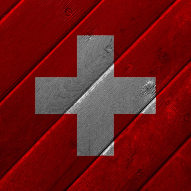 Foto bandeira da confederação suíça em um fundo texturizado colagem conceitual