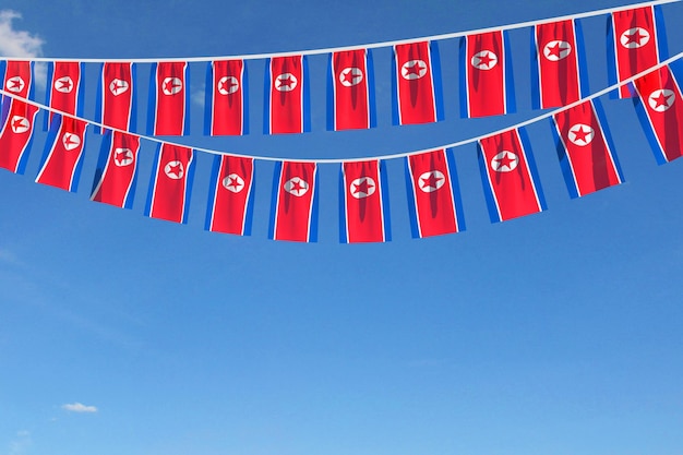 Bandeira da coreia do norte bandeira festiva pendurada contra um céu azul d render