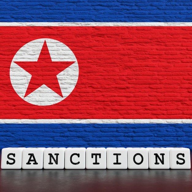 Bandeira da Coreia do Norte em muro de tijolos com sanções