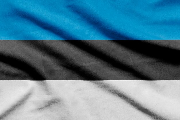 Bandeira da Estônia em tecido ondulado.