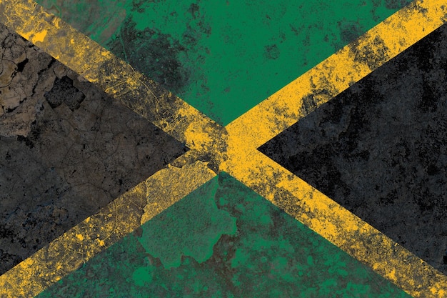 Bandeira da Jamaica em uma superfície de parede de concreto velha danificada