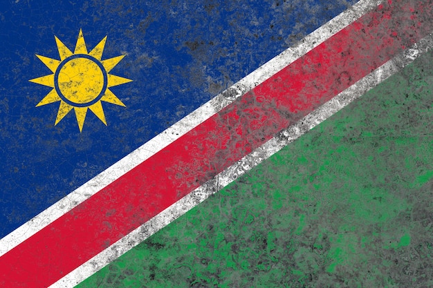 Bandeira da Namíbia em uma superfície de parede de concreto velha danificada