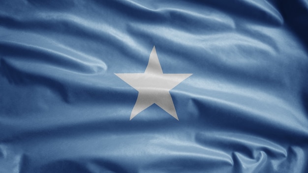 Bandeira da Somália balançando ao vento. Feche de sopro de modelo somali, seda macia e suave.