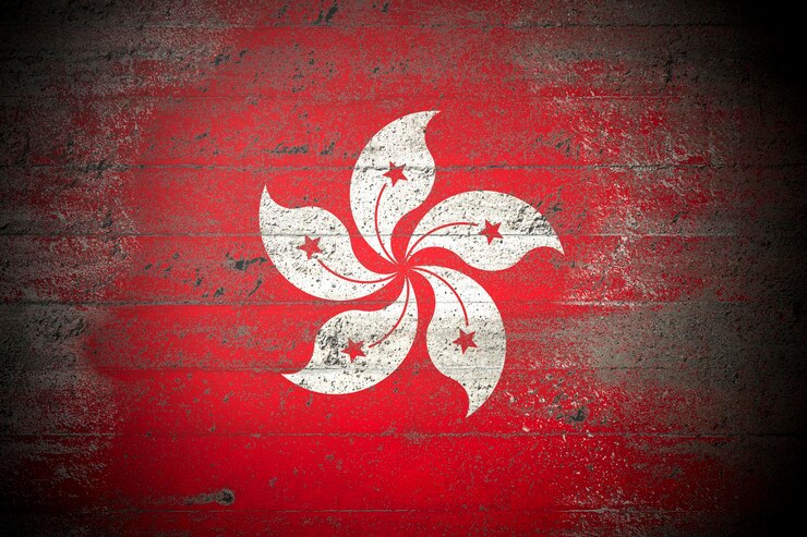 Foto bandeira de hong kong em uma parede de concreto áspera