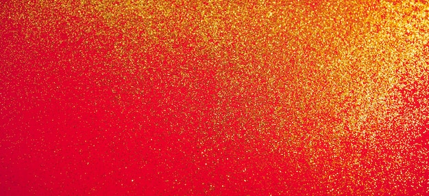 Foto bandeira de natal e ano novo com brilhantes dourados em fundo vermelho