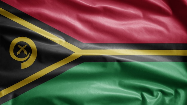 Bandeira de Vanuatuan balançando ao vento. Molde de Vanuatu soprando, seda macia e lisa. Fundo de estandarte de textura de tecido de pano. Use-o para o dia nacional e o conceito de ocasiões do país.