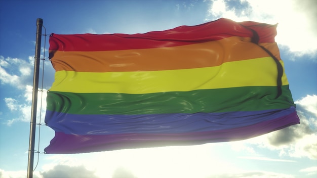 Foto bandeira do arco-íris de uma organização lgbt tremulando contra um céu azul