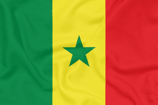 Bandeira do senegal em tecido texturizado. símbolo patriótico