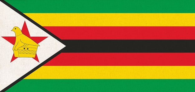 Foto bandeira do zimbábue bandeira nacional do zimbàbue em superfície de tecido