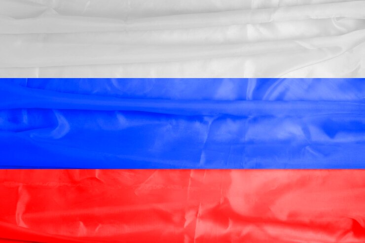 Foto bandeira dos símbolos do estado da rússia da federação russa closeup fundo de foco seletivo