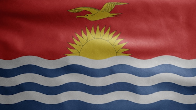 Bandeira IKiribati balançando ao vento. Perto da bandeira do Quirguistão soprando, seda macia e suave. Fundo de estandarte de textura de tecido de pano. Use-o para o dia nacional e o conceito de ocasiões do país.