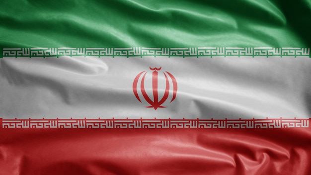 Bandeira iraniana balançando ao vento. detalhe da bandeira do irã soprando seda suave