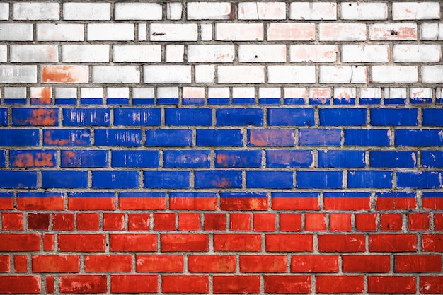 Bandeira nacional da Rússia em um fundo de tijolos de grunge