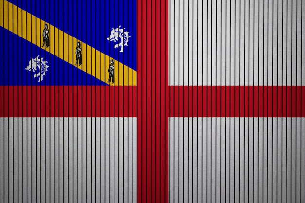 Bandeira nacional pintada de herm em um muro de concreto