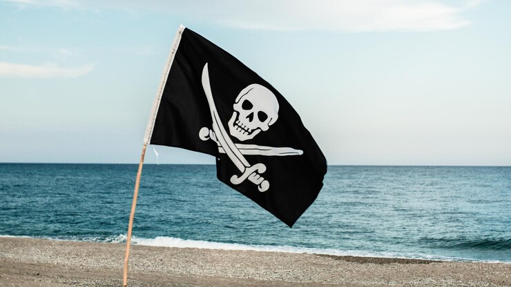 Foto bandeira pirata preta com símbolo de crânio na ilha deserta