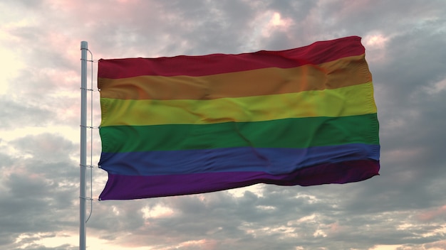 Bandeira realista do orgulho lgbt balançando ao vento contra o céu profundo e dramático. renderização 3d