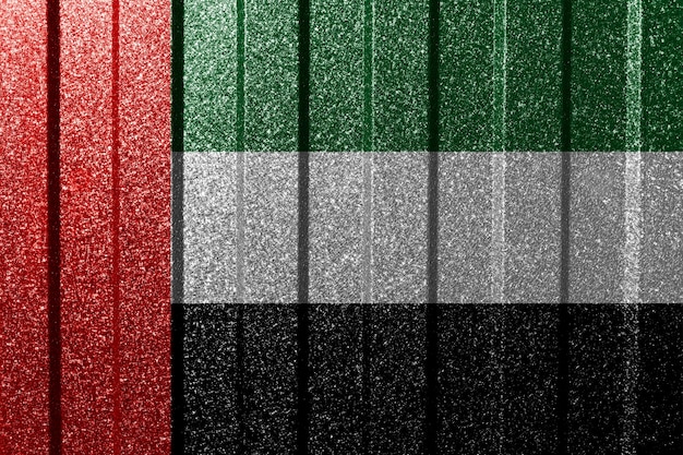 Foto bandeira texturizada dos emirados árabes unidos na parede de metal fundo geométrico abstrato natural colorido com linhas