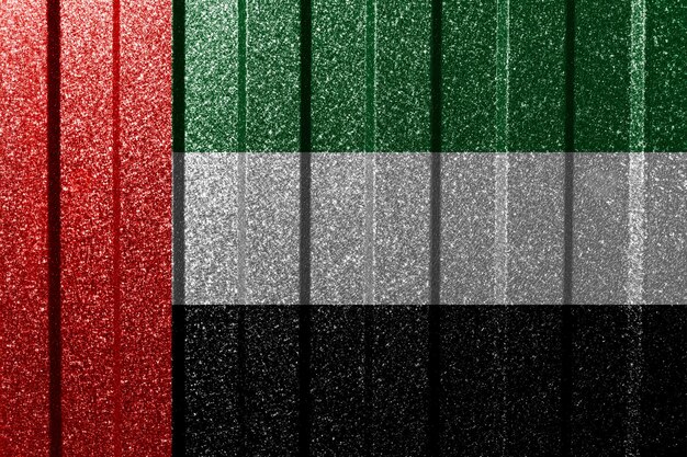 Bandeira texturizada dos Emirados Árabes Unidos na parede de metal Fundo geométrico abstrato natural colorido com linhas
