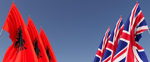 Bandeiras da Grã-Bretanha e Albânia em mastros nas laterais Bandeiras em um fundo azul Inglaterra Reino Unido Tirana os Balcãs ilustração 3D
