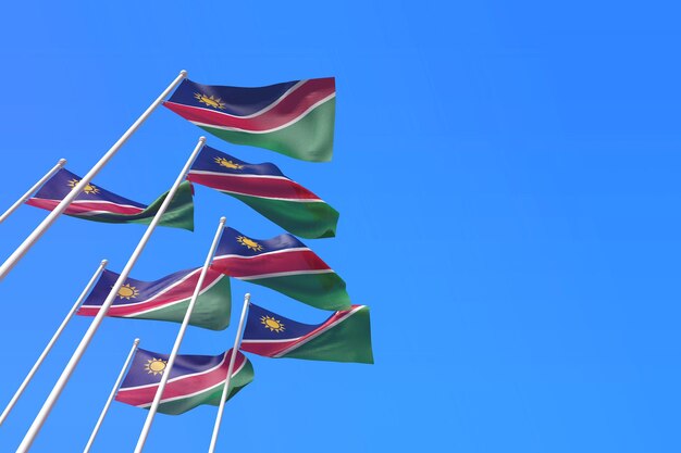 Bandeiras da Nigéria balançando ao vento contra um céu azul d renderização